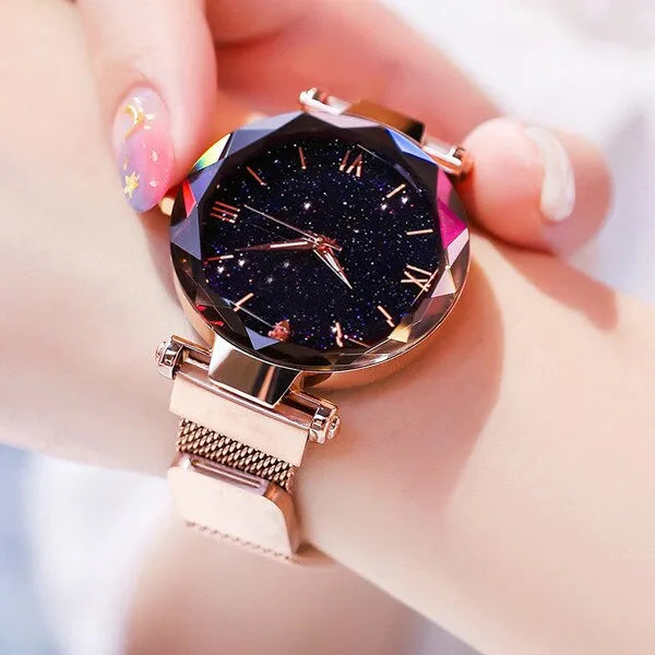 Montre avec cadran étoilé couleur or rose