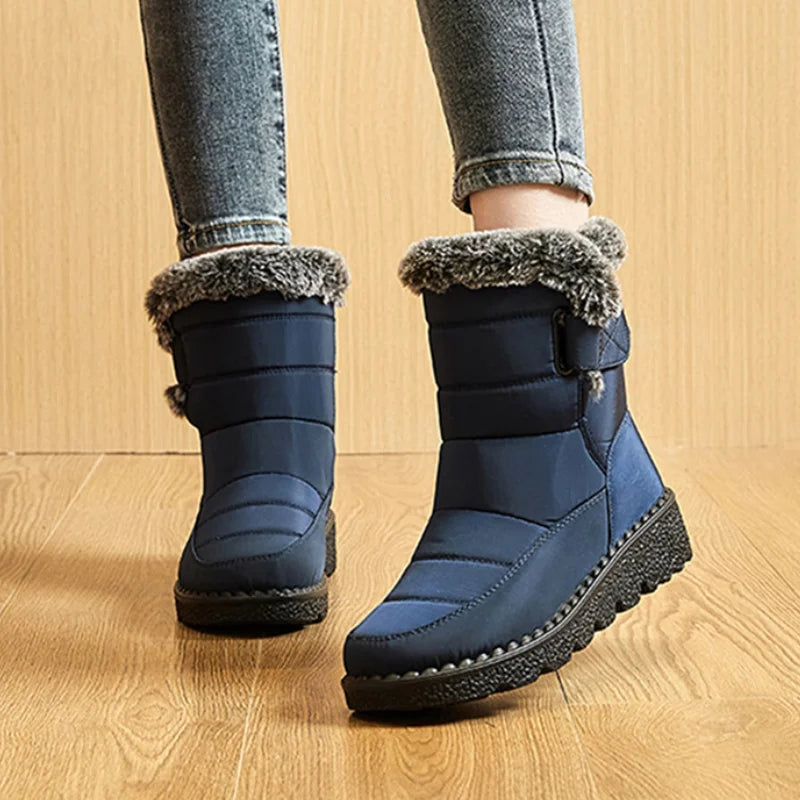 Femme portant les bottes chaudes hiver